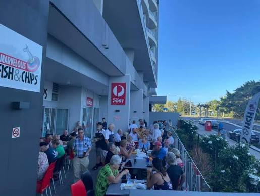 Locals dining outside Marvelous Fish & Chips